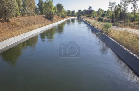Photo for Orellana Irrigation canal crossing Vegas Altas del Guadiana, Badajoz, Extremadura, Spain - Royalty Free Image