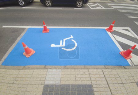 Photo for Reserved parking for vehicles of people with disabilities. Just painted floor signal - Royalty Free Image