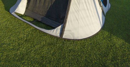 Iglu tents installed on artificial grass. Sunny natural light
