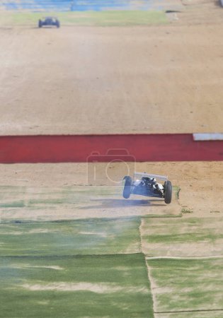 Photo for Merida, Spain - Jan 28th, 2024: Extremadura 1/8tt gas Championship RC Car. Cars crossing the finish line - Royalty Free Image
