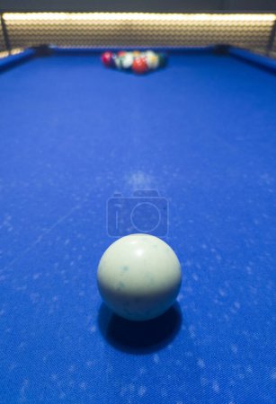 Full rack ready for the break shot. Eight-ball pool game at six pocket blue table. 
