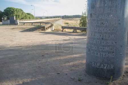 Photo for Campo Maior, Portugal. 2019, Agust, 9th: Salazar gray concrete monolith at Barragem do Caia, Campo Maior, Alentejo, Portugal. Commemorative monument honouring the dictatorship Salazar - Royalty Free Image