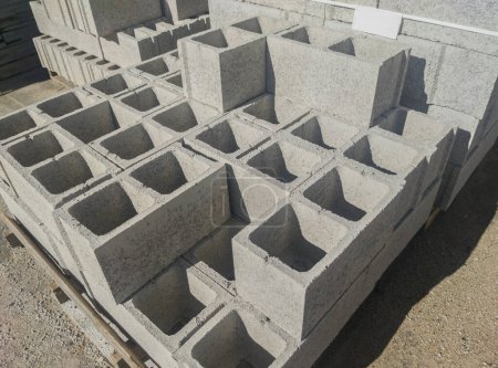 Photo for Full size hollow concrete blocks for plastering. Packed over wooden pallets - Royalty Free Image