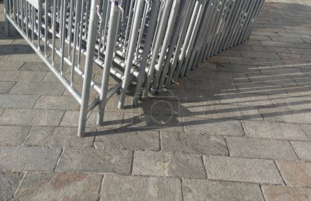 Mobile fences stacked for next mass event over downtown cobbled floor