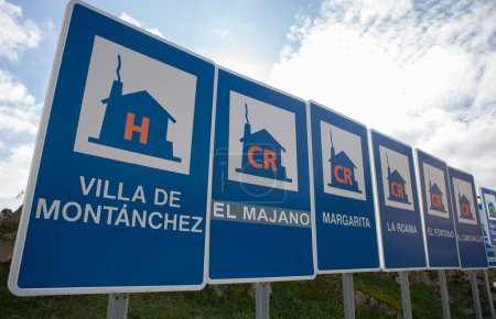 Photo for Montanchez, Spain - Jan 12nd, 2024: Rural accomodation sign posts placed at village entrance, Montanchez, Spain - Royalty Free Image