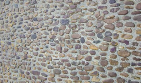 Pavé pavé fait de petits cailloux. Monumental Complex road surfaces, Caceres, Espagne