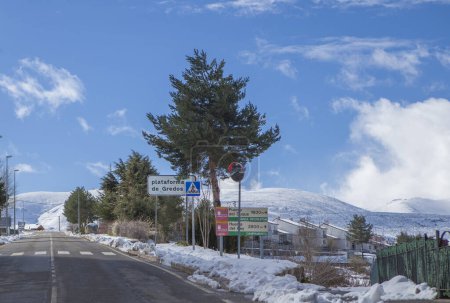 Plataforma de Gredos road sign, Hoyos del Espino, Avila, Castile and Leon, Spain. Snowy landscape