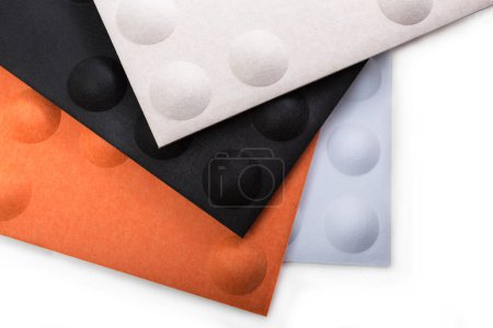 Foto de Acoustic panels with convex spheres in beige, black, orange, light blue colors - Imagen libre de derechos