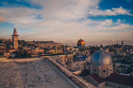 Photo for Jerusalem, Capital of Israel. Beautiful panoramic view of the Old City at sunset, Tomb of the Prophets and Dome of the Rock, typical stoned houses. Blue Sunny and Cloudy Sky.Historic Architecture. - Royalty Free Image