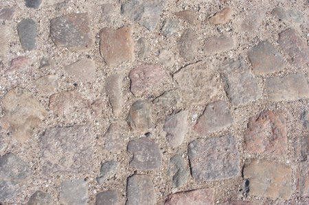 Grey cobblestone with grit street pattern background