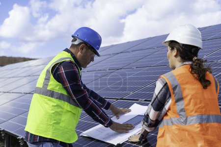 Photo for Engineer in solar panel and solar panel working on power plant. - Royalty Free Image