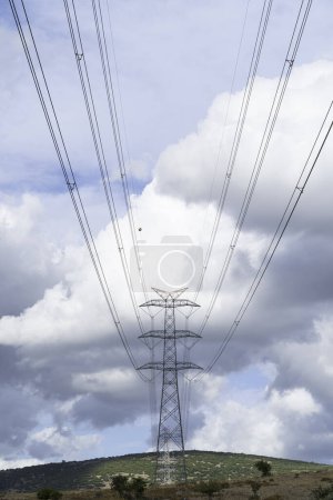 Photo for Power pylons and high-voltage lines against the background of the cloudy sky, power lines. - Royalty Free Image