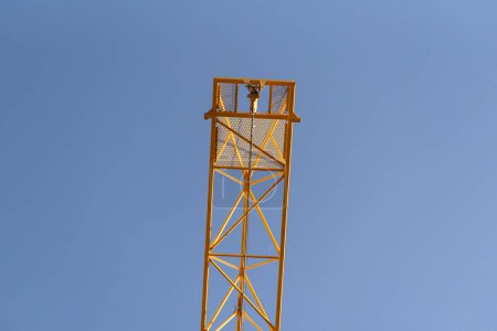 Part of a crane boom against the sky