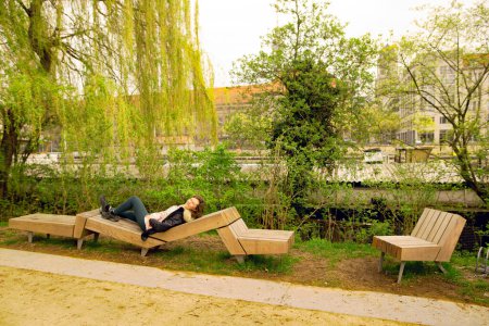 Capturing a mature and attractive brunette lady in Berlin, relaxing by the Spree River, in Berlin.