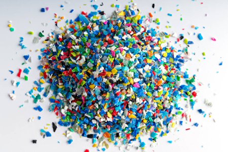 Photo for Small pieces of crushed plastic. Crushed bottle caps for recycling. Plastic waste that will be mixed with plastic vergin. Concept reducing plastic. - Royalty Free Image