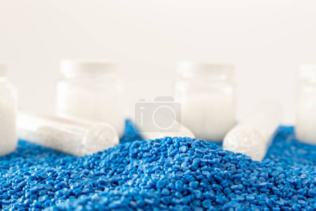 Photo for White plastic grain, plastic polymer granules,hand hold Polymer pellets, Raw materials for making water pipes, Plastics from petrochemicals and compound extrusion, resin from plant polyethylene. - Royalty Free Image