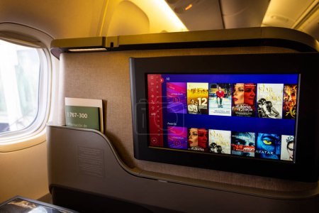 Photo for San Francisco, California, USA, 10 December, 2022: Modern airplane interiors, luxury first class and business class seats with entertainment area - Royalty Free Image
