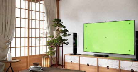 Photo for Smart Tv Mockup with blank green screen hanging in modern white empty room interior minimal designs. - Royalty Free Image