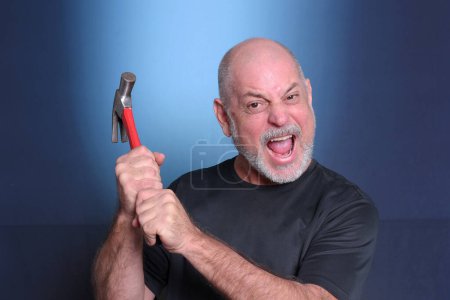 Photo for Adult man using holding hammer service equipment tool for mechanic locksmith nailing material objects"Senior Life" - Royalty Free Image