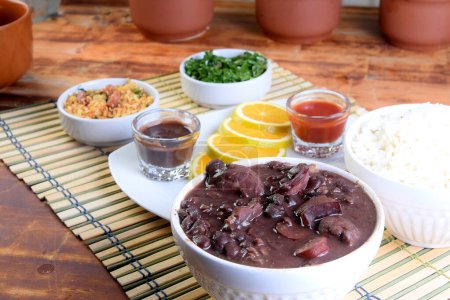 Photo for Feijoada typical brazilian food beans pork bacon rice salad taste - Royalty Free Image