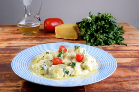 Gnocchi with white bchamel sauce typical Italian pasta potato food taste