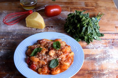 Gnocchi with red Bolognese sauce, typical Italian pasta potato food taste