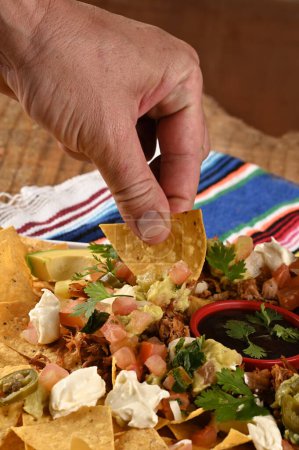 Foto de Tacos de comida mexicana guacamole jalapeño burritos quesadillas nacho tortilla tex-mex cuisine comida saludable especiado tomate y cebolla - Imagen libre de derechos