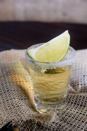 shot of tequila Brazilian  distilled alcohol drink with lemon image