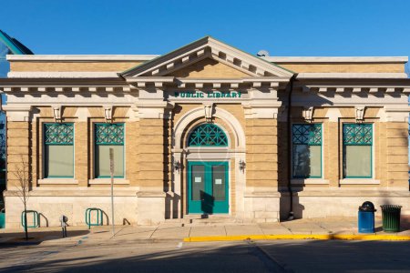 Photo for Stroughton, Wisconsin - United States - November 7th, 2022: Exterior of the Stroughton Public Library building, built in 1905, on a sunny Fall morning. - Royalty Free Image