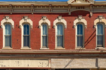 Exterior wall and windows of old downtown building in Marengo, Illinois, USA.