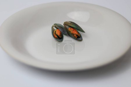 Photo for Mussels on white dish - Royalty Free Image