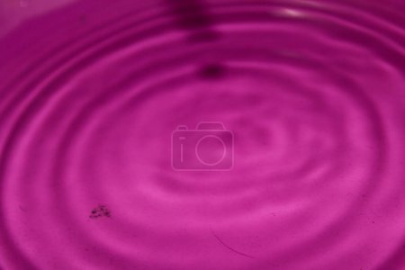 Photo for Water drop on a pink  background - Royalty Free Image
