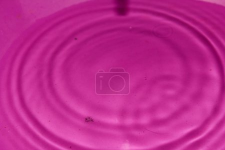 Photo for Water drop on a pink  background - Royalty Free Image