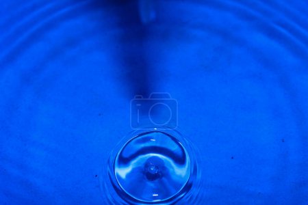 Photo for Water drop on a blue background - Royalty Free Image