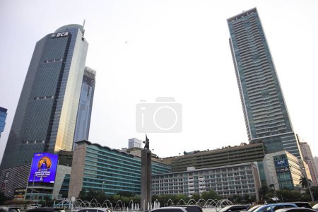 Photo for Jakarta, February 19, 2023; Welcome Monument is a statue of a pair of people who are holding flowers and waving a hand located in the middle of the Hotel Indonesia Roundabout - Royalty Free Image