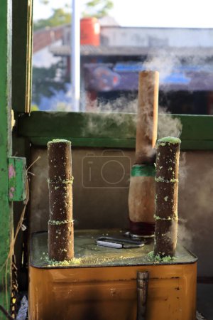 Photo for Making Putu Bambu cakes or Putu Bambu cakes, traditional snacks from street vendor carts. - Royalty Free Image