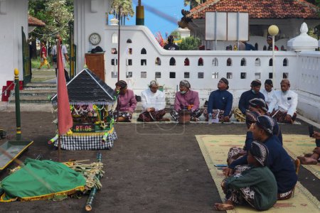 Photo for Parang Tritis Beach, Yogyakarta 7 June 2022: Annual Festival of the Sea Offering. The community around Parangtris beach holds a traditional celebration called Labuhan Bhakti Pisungsung Jaladri. - Royalty Free Image