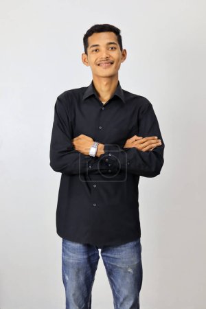 Photo for Indonesian man wearing black shirt isolated white background. - Royalty Free Image