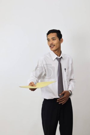 Photo for Young handsome businessman with a folder on a white background - Royalty Free Image