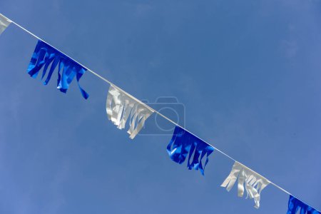 Photo for A row of alternating white and blue flags in the colors of the Israeli flag. - Royalty Free Image