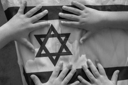 Photo for Touching Image. Childrens Hands On Israeli Flag with Magen David Symbol - Love Israel, Support, Unity, Patriotism, Heritage, Jewish Identity. - Royalty Free Image