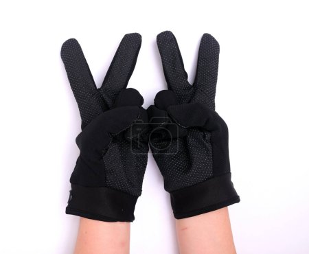 Black cloth palm gloves with anti-slip grip, isolated on white background.