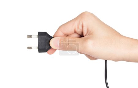 closeup hand holding electrical plug and power socket on white background