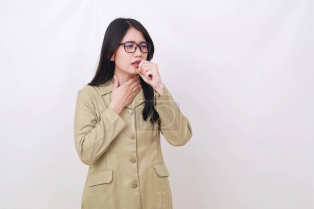 Photo for Young Indonesian civil servant coughing and having problem with her throat - Royalty Free Image