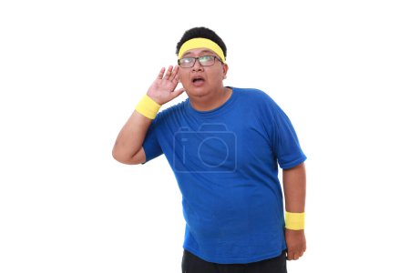 Photo for Asian overweight man in sportswear listening something while put his hand to ear - Royalty Free Image