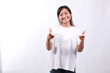People emotions, lifestyle and fashion concept. Enthusiastic and friendly smiling pretty girl pointing fingers at camera, praising nice job, picking you, complimenting, white background