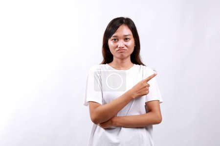 Moody upset whining woman unhappy pointing right, sulking look miserable and distressed, express regret and disappointment, complain bad fortune, stand white background displeased