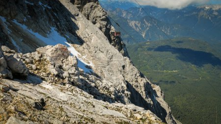 View of the descending cable car or gondola. Zugspitze massif in the bavarian alps