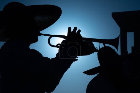 Photo for Close up of Mexican Mariachi,  traditional musical ensemble generally made up of a minimum number of three members; generally using guitar, guitar, violin and trumpets - Royalty Free Image