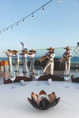 Photo for San Lucas Los Cabos, Mexico - 2023 Mexican Mariachi is a traditional musical ensemble generally made up of a minimum number of three members; generally using guitar, guitar, violin and trumpets - Royalty Free Image